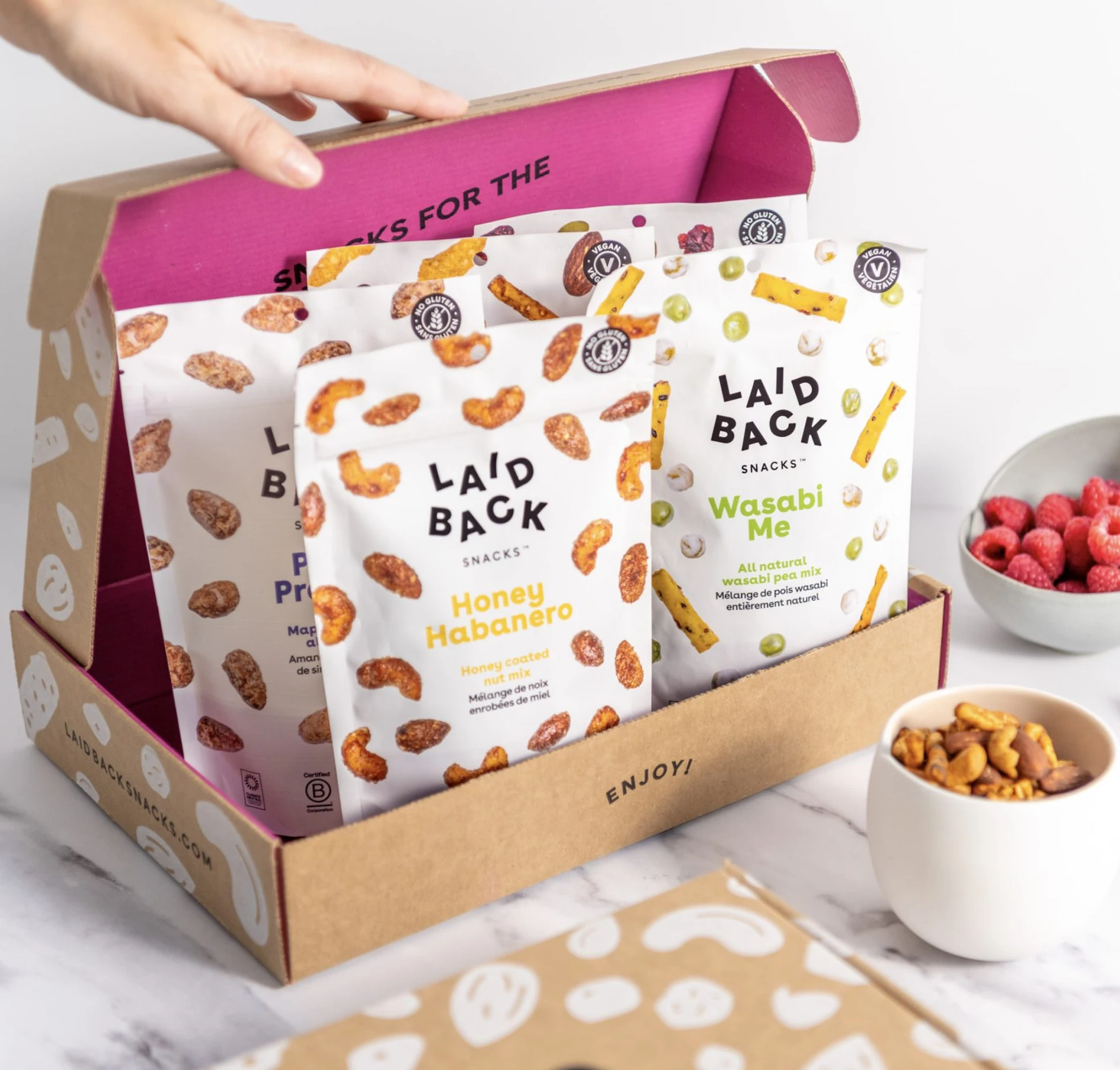 https://zestybrands.ca/wp-content/uploads/2023/07/package-design-branding-agency-zesty-brands-laid-back-snacks.webp